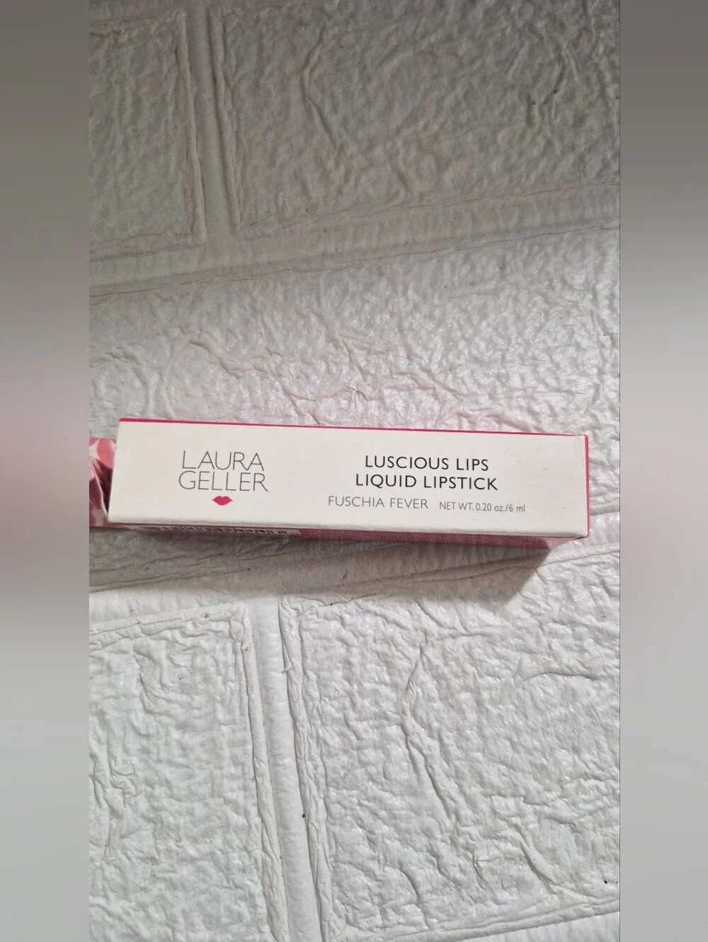 Laura Geller Luscious Lips Liquid Lipstick packaging in the shade Fuschia Fever